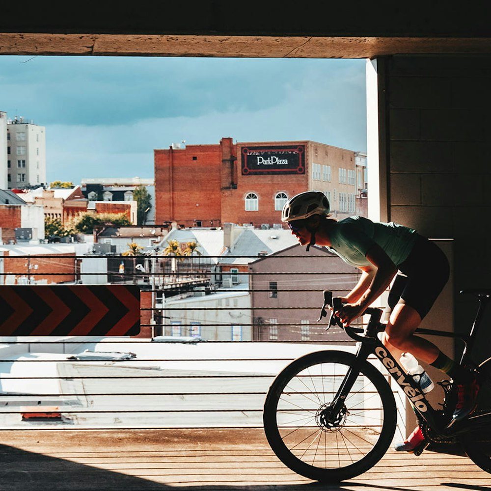 Riding a Cervelo road bike with buildings in the background