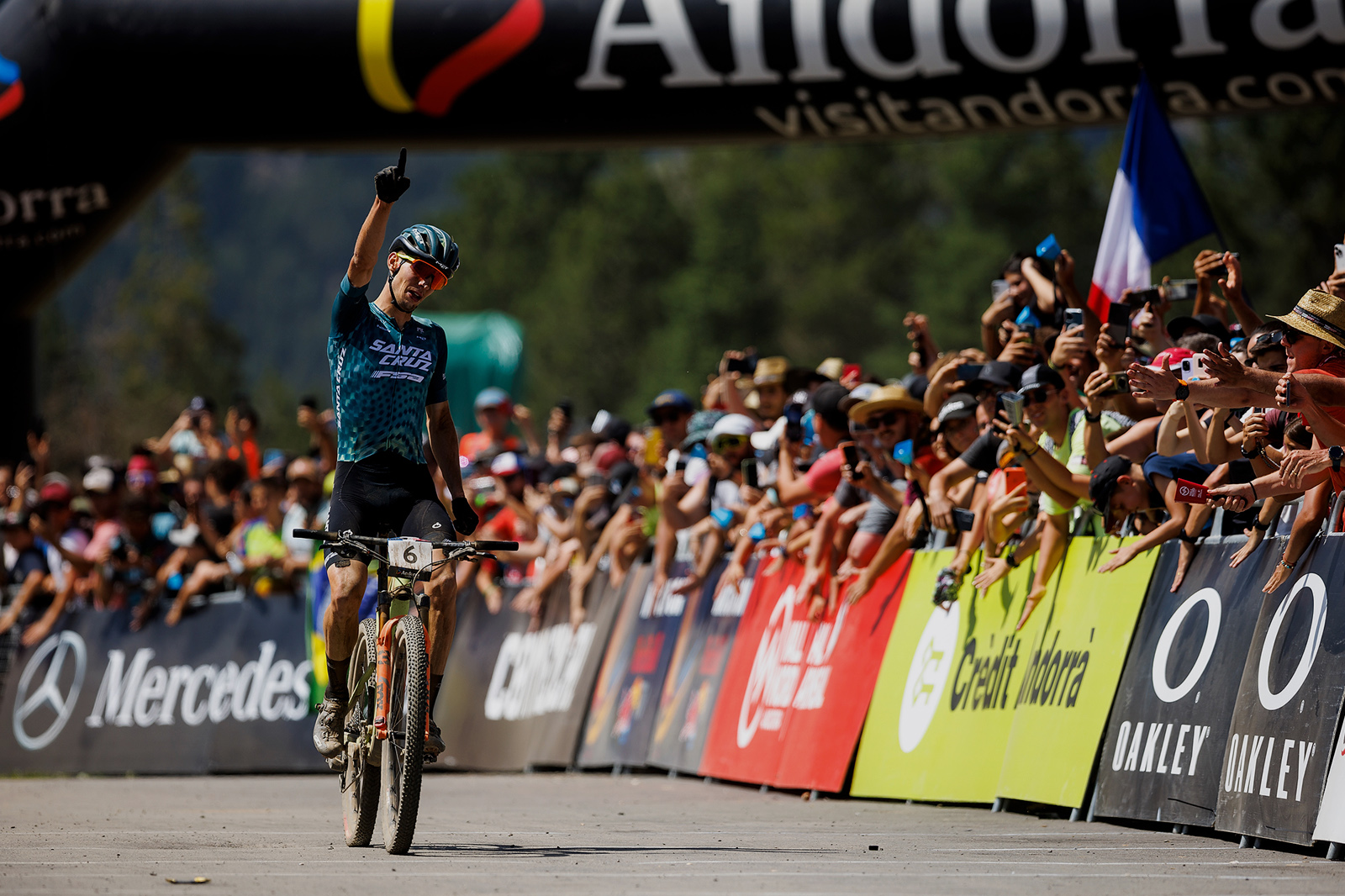 Luca Braidot riding his Santa Cruz Blur across the finish line in Andorra