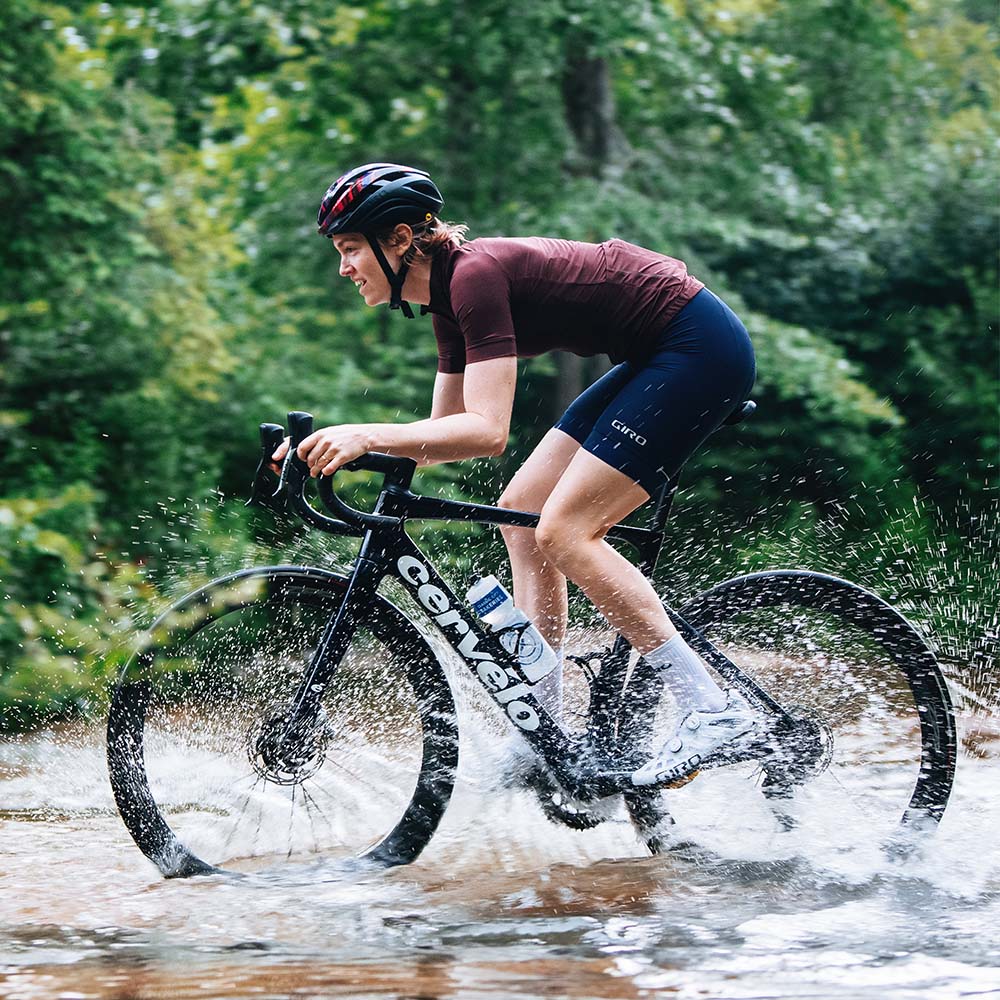 Splashing through deep water on a Cervélo road bike