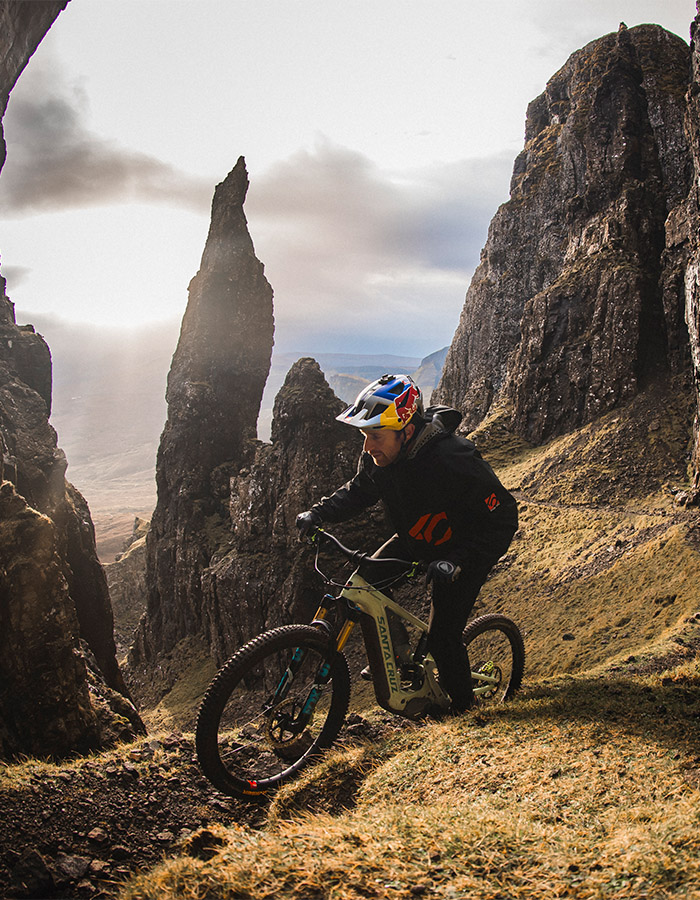 Danny MacAskill riding his Heckler 9 up a rocky trail
