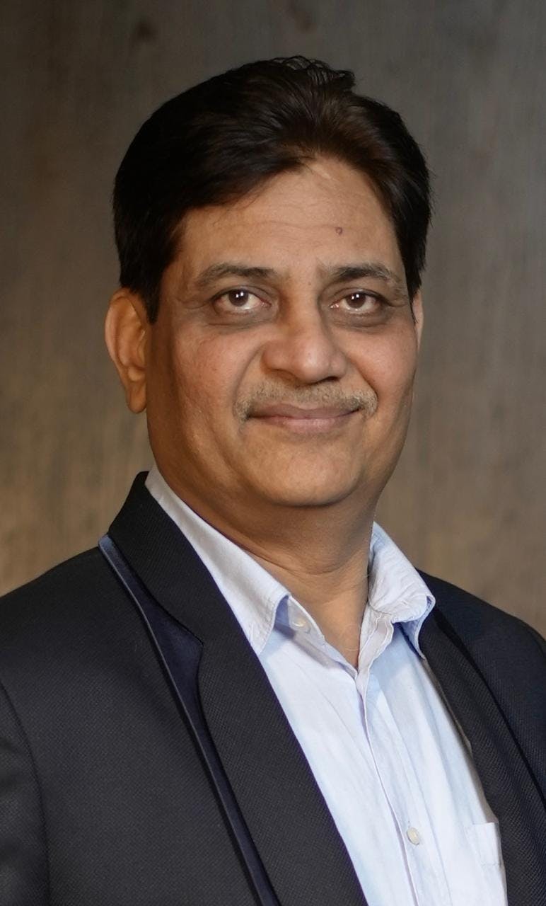 close up headshot of rakesh gupta