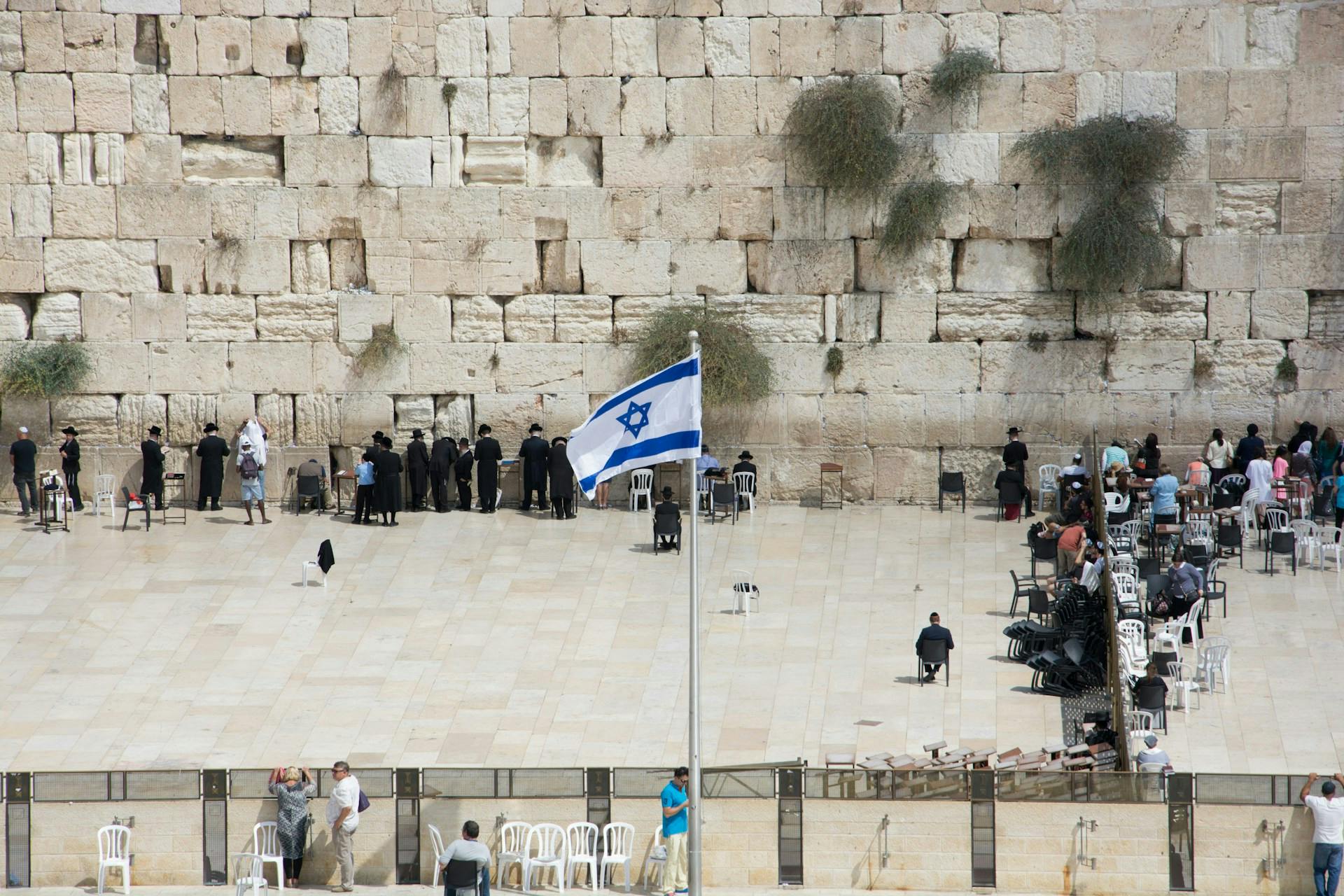 Western Wall in Jerusalem with Israeli flag