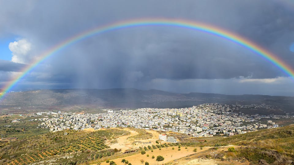 A rainbow appears over Cana in the Galilee region of Israel