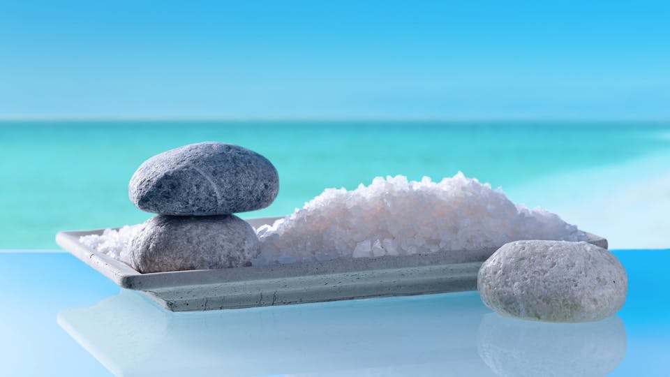 Sea salt with stones on a background of seascape