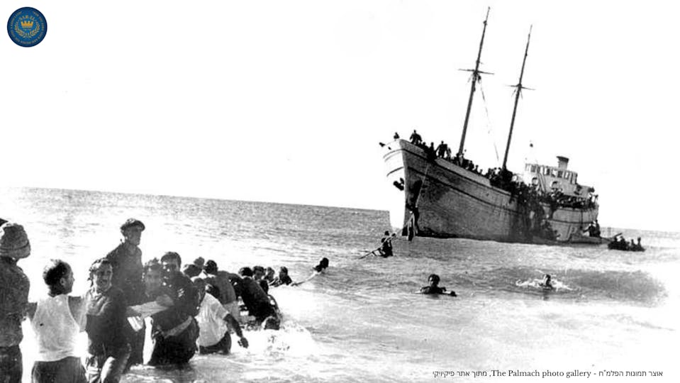 a picture of people pulling a ship in the sea.