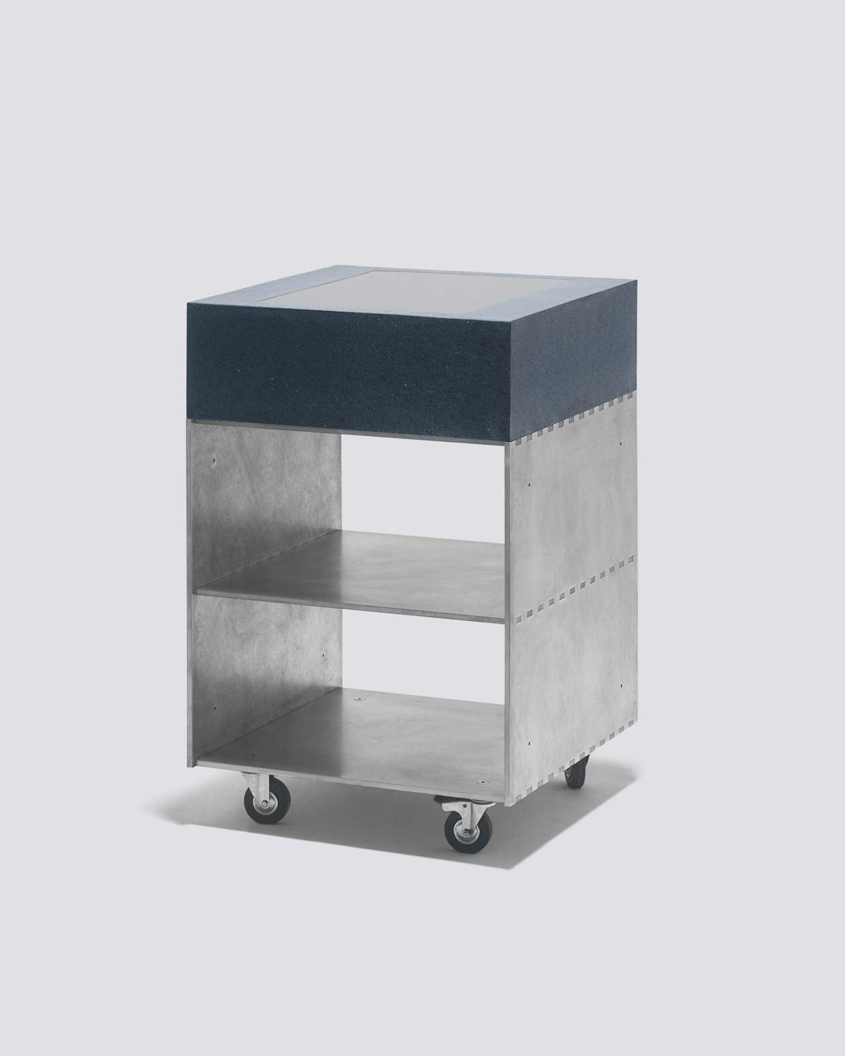A metal kitchen module with a blue top