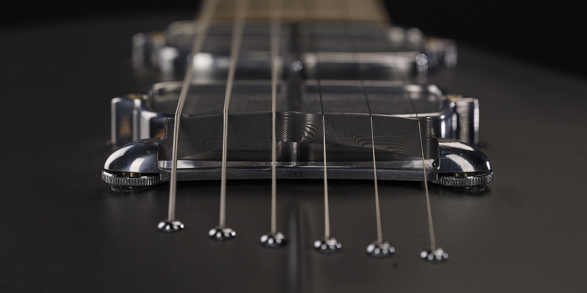 bridge on the body of the One piece master I guitar