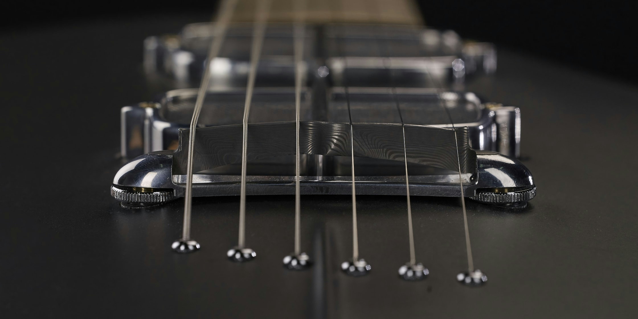 bridge on the body of the One piece master I guitar