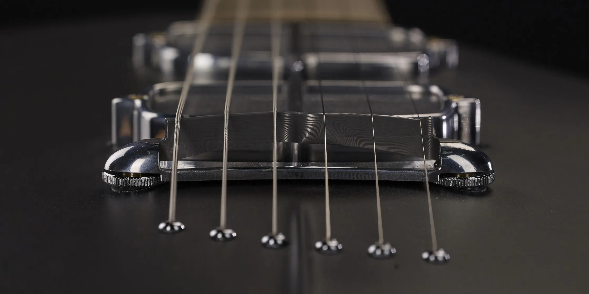 bridge on the body of the One piece master I guitar