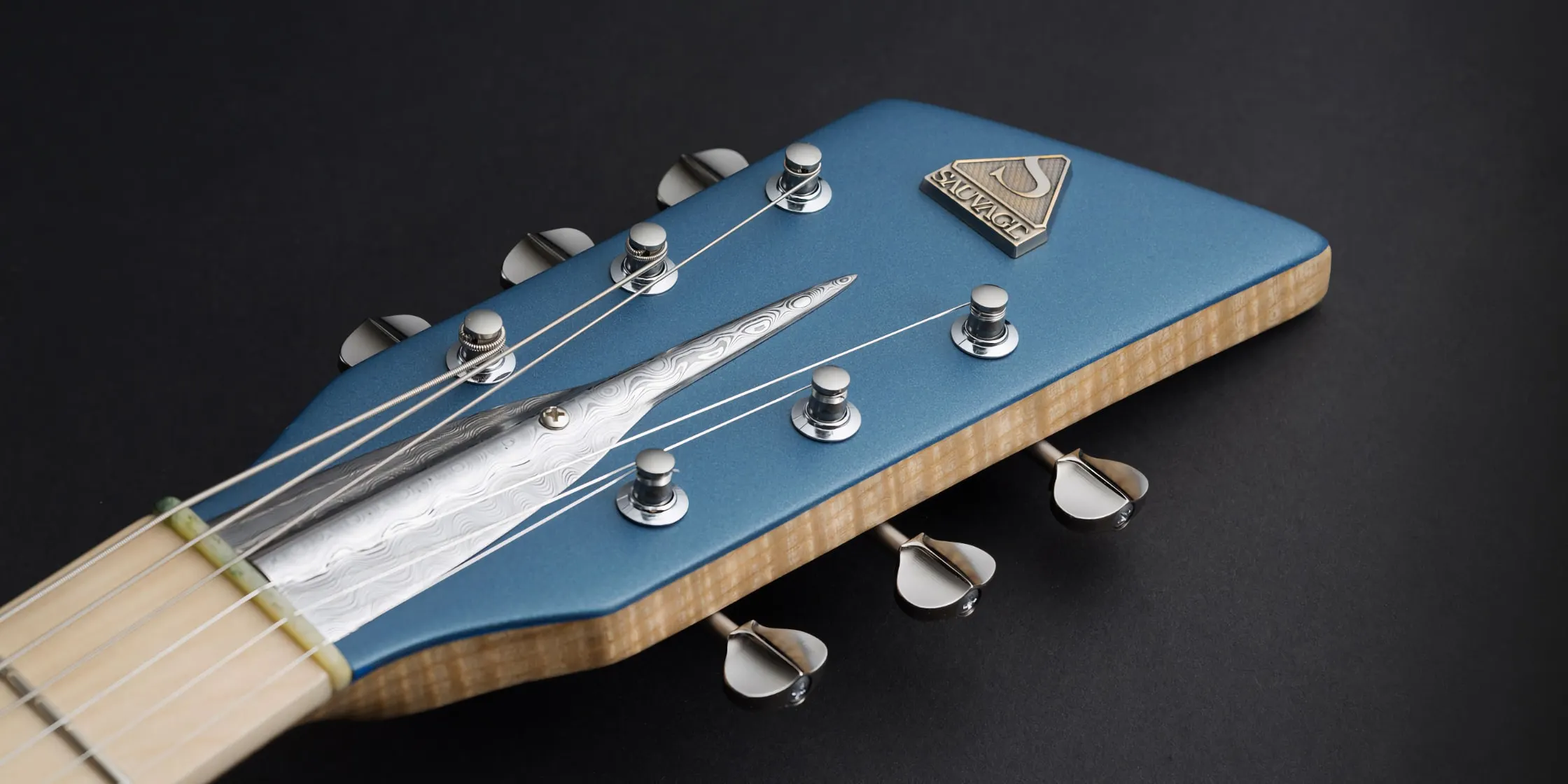 headstock on the One piece master III guitar