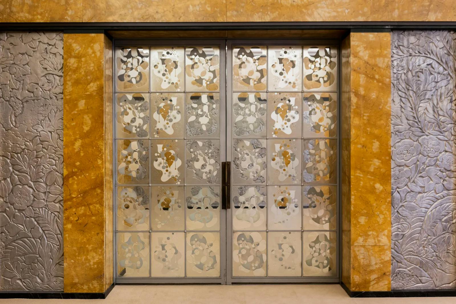 Etched glass doors by Max Ingrand in the dining room 