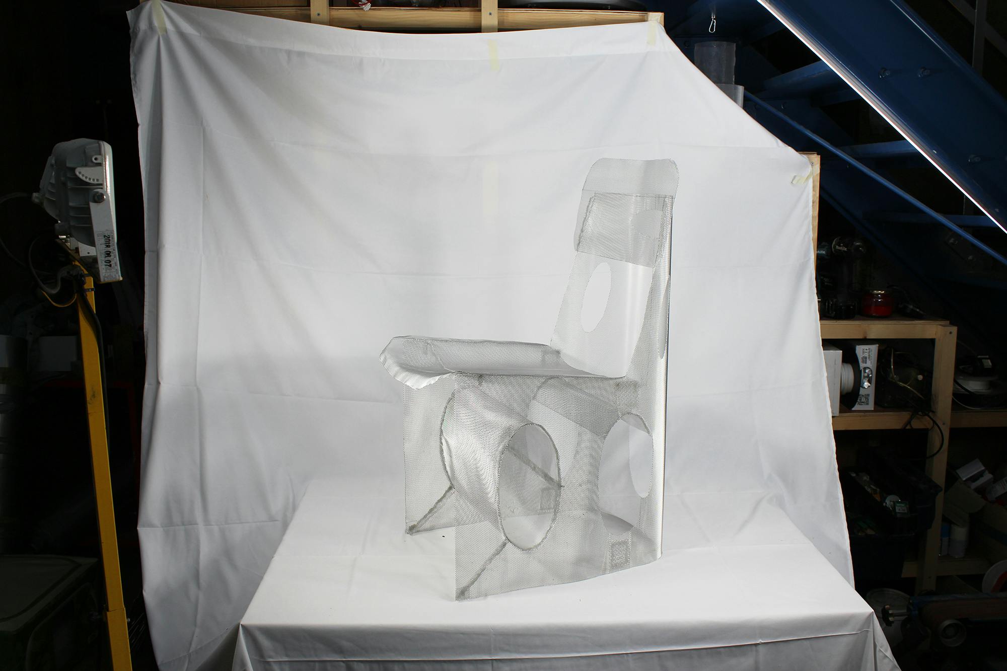 The metal mesh frame of a chair from Korean Designer, Seongil Choi's Hardned Mesh Project