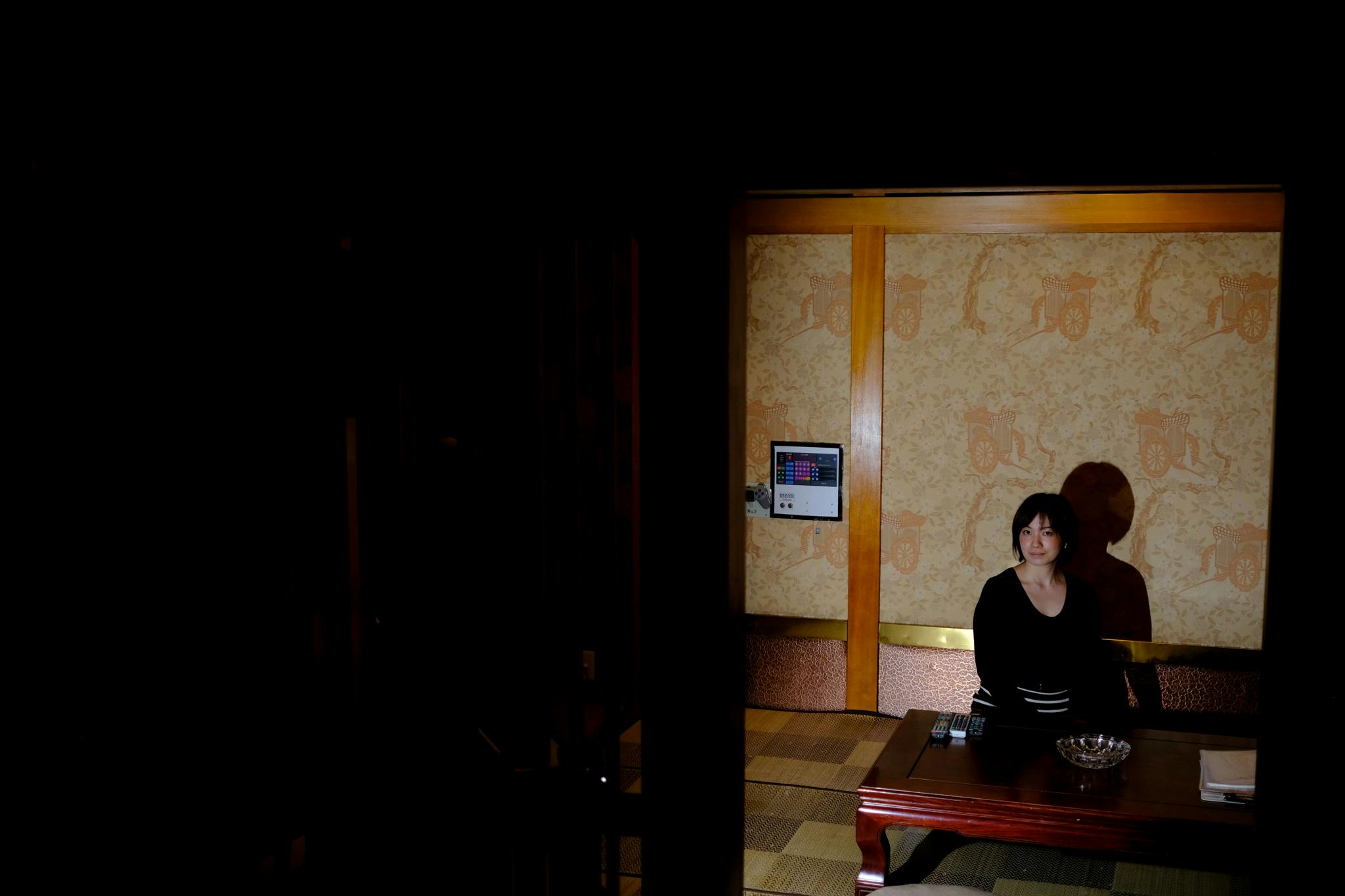 Oni is seen sitting in the tea parlour and karaoke room of the Historic Japanese Themed room at Hotely Famy Love Hotel