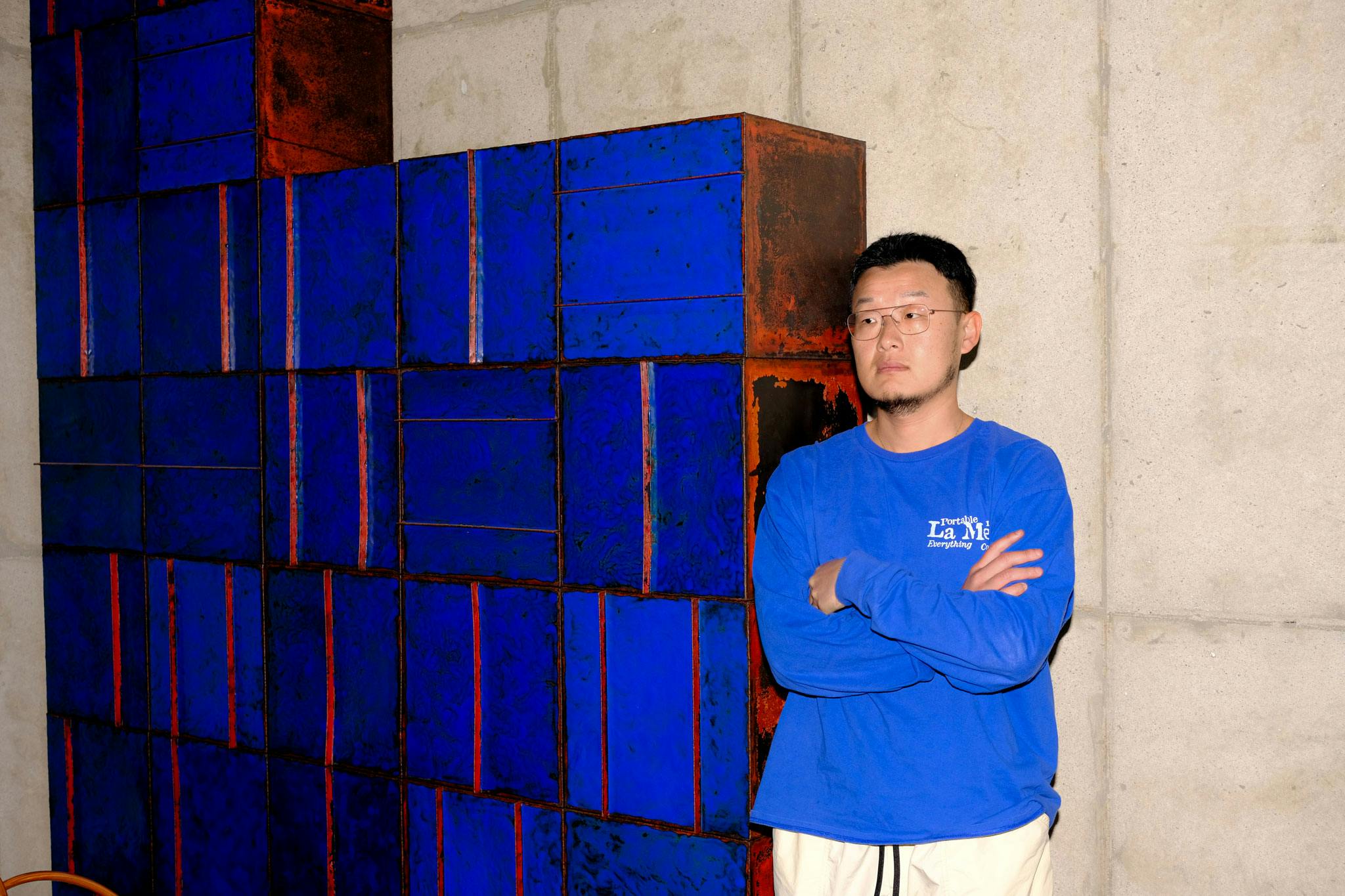 Kwangho Lee in front of a piece made from Copper and Klein Blue Chilbo Enamel | Photo by Kristen de la Vallière
