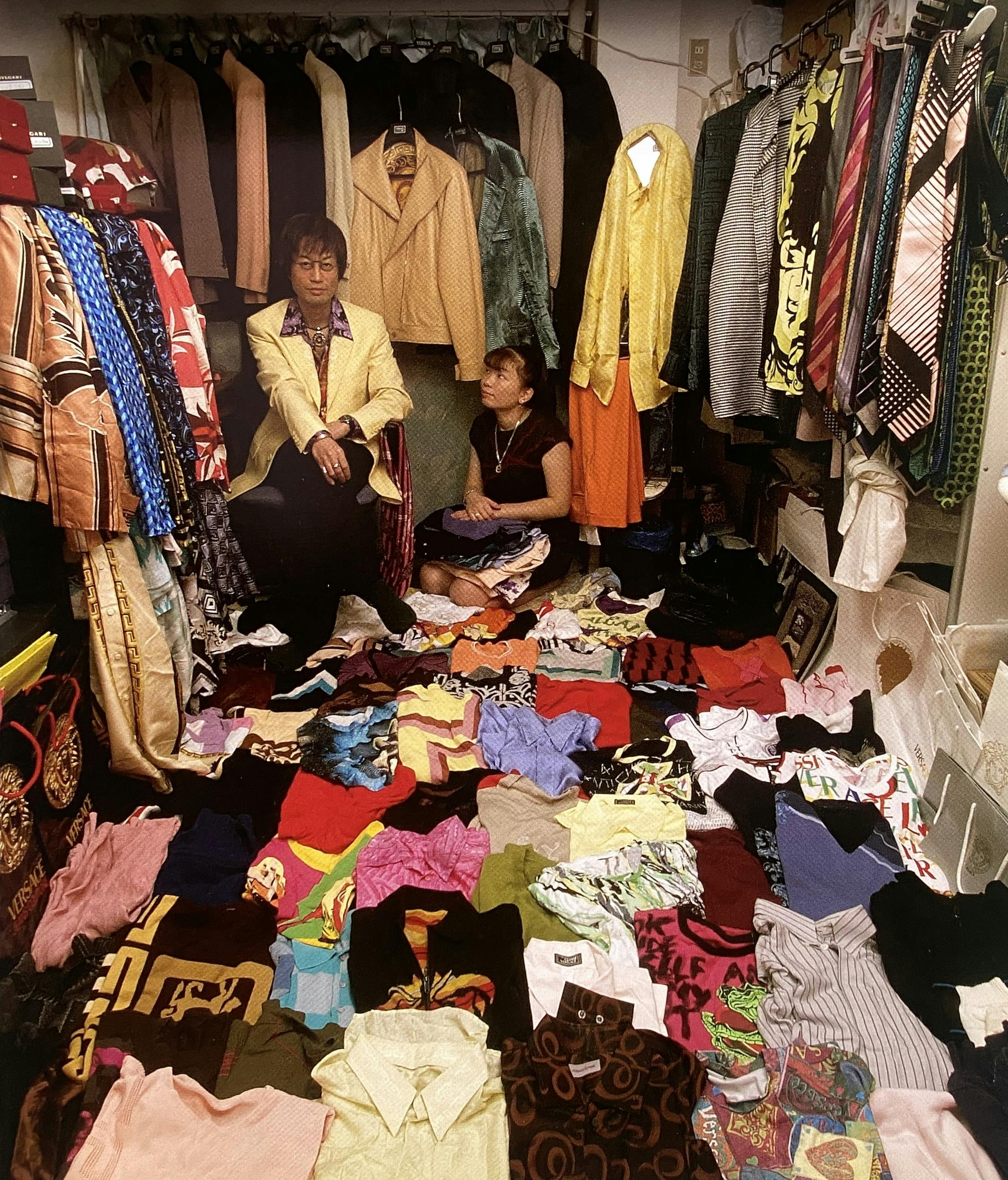 A Photo taken by Kyoichi Tsuzuki from his book HAPPY VICTIMS, showcasing two 'Fashion Victims' and their collection at home