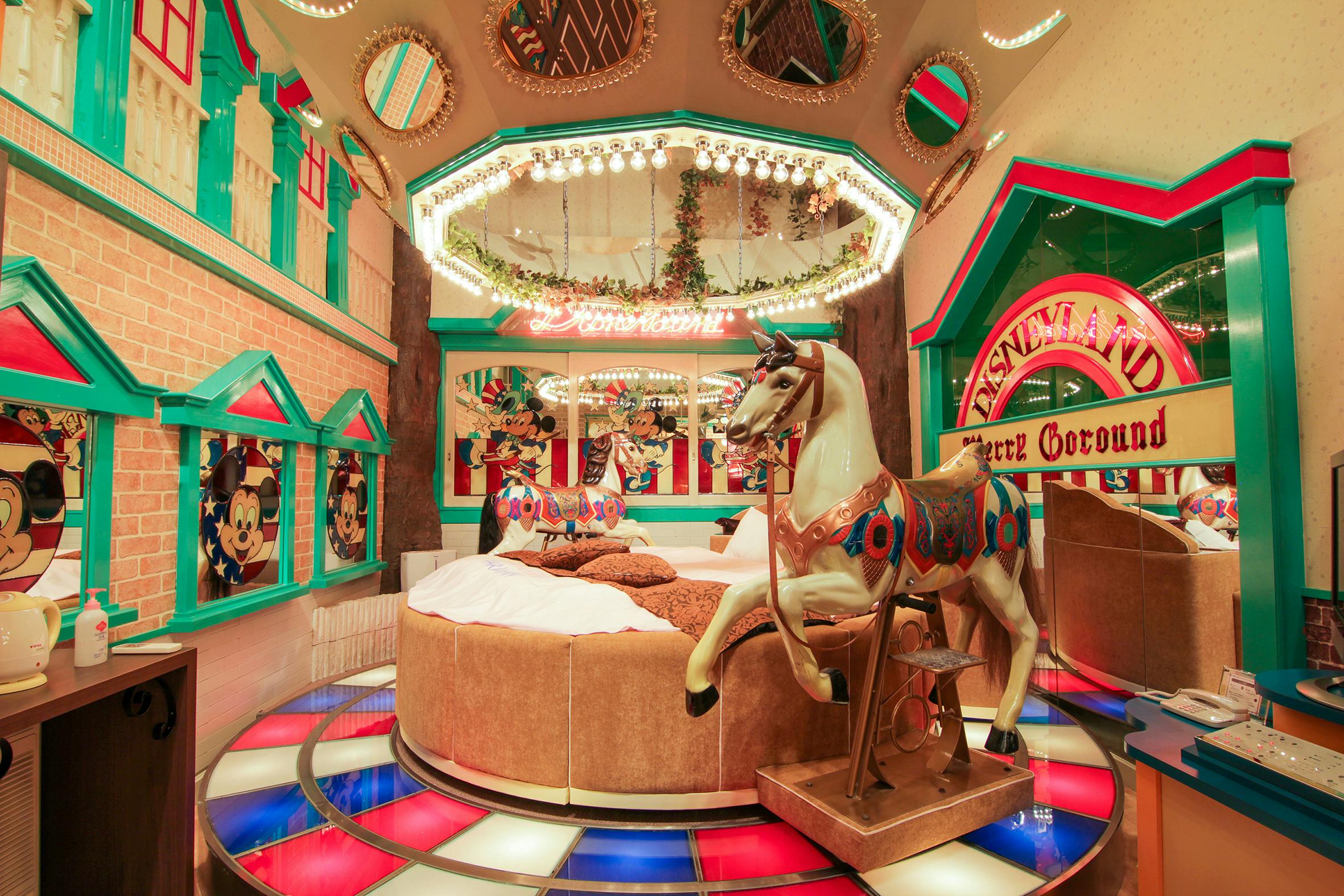 Rotating Round Bed is center stage in the carousel in Theme Park inspired room at Hotel France Love Hotel