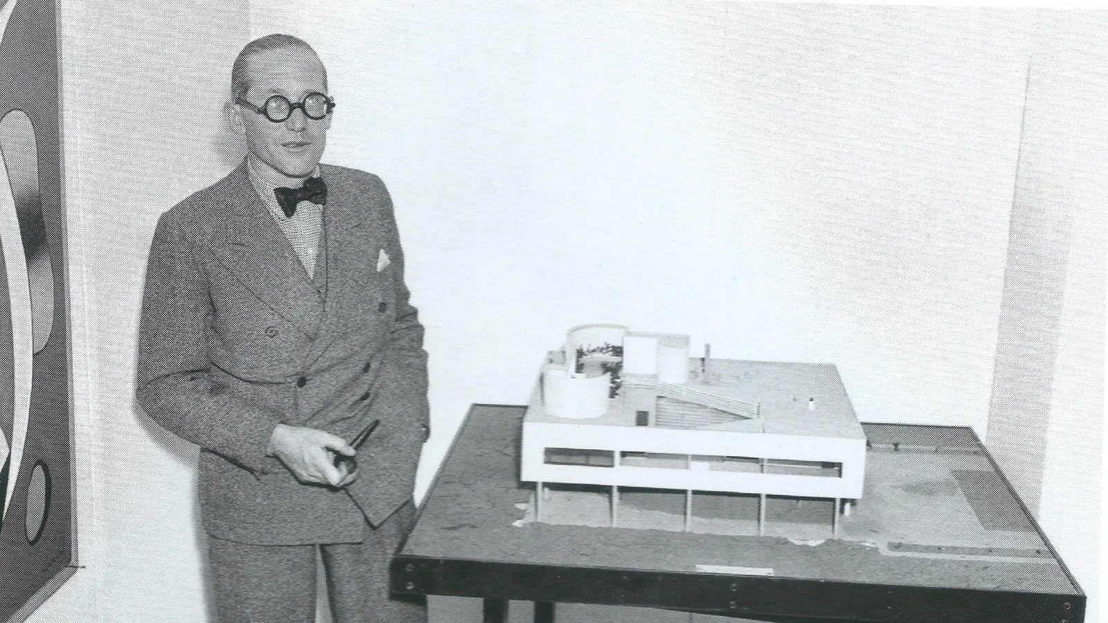 Le Corbusier next to a scale model of Villa Savoye, date unknown.