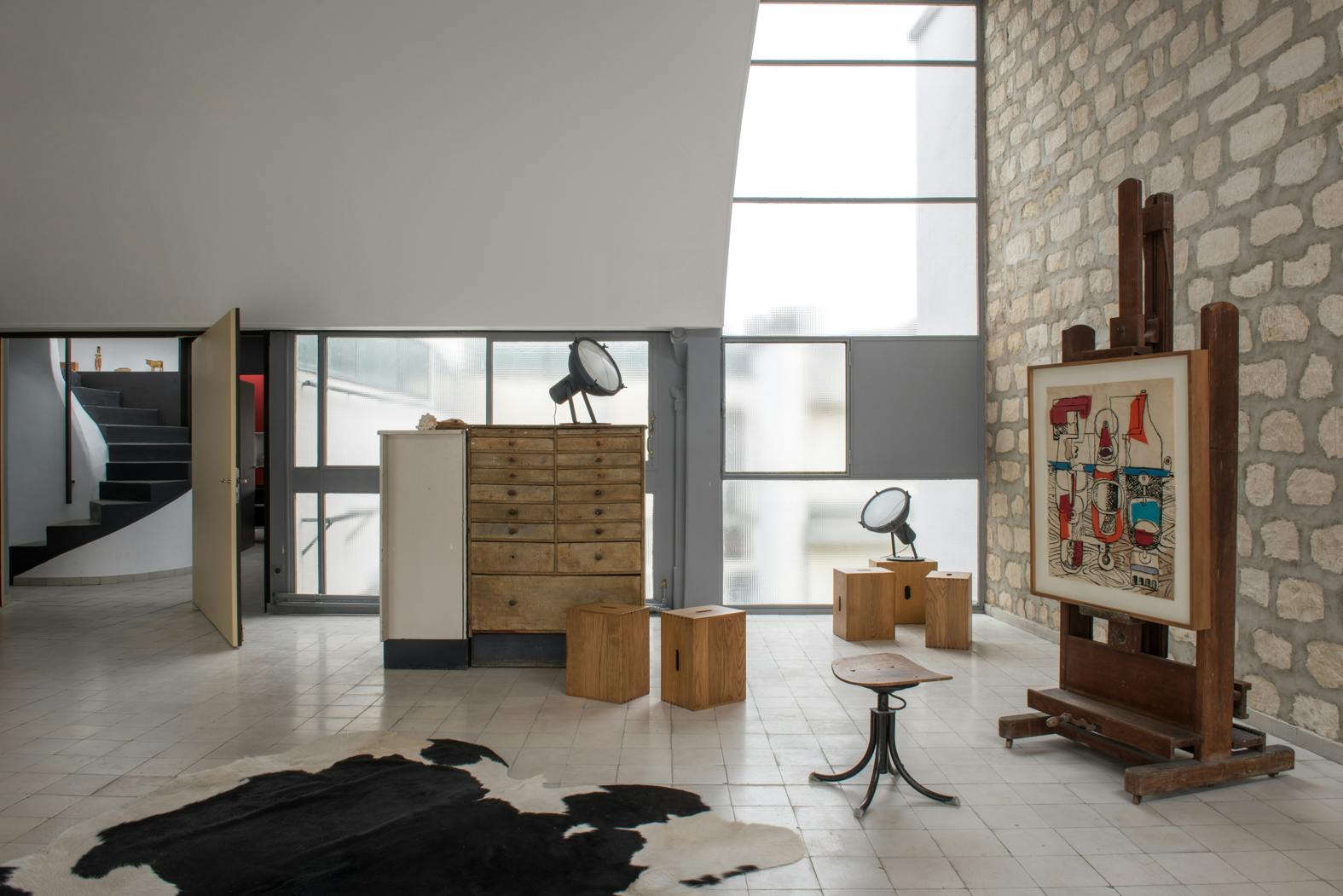 Many of Le Corbusier's iconic furniture pieces are displayed in the atelier, including LC1 and LC2 armchairs and a unique table he designed for himself. François Chatillon led the restoration project.