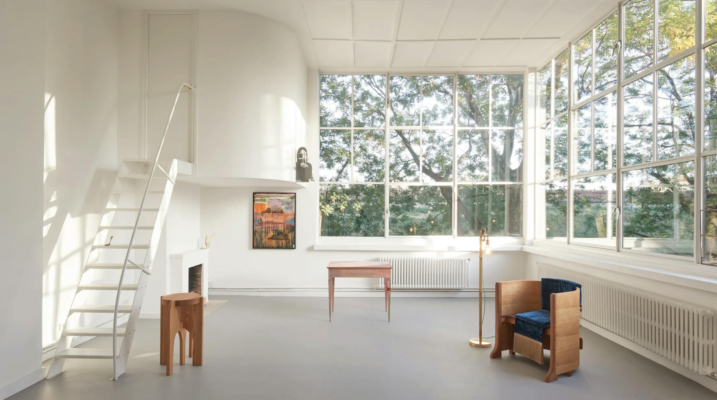 Genius Loci Exhibition - In the foreground: Lion Lamp (brass, 2022), Lombard Desk (lacquered pine, leather, 2022-2023); in the background: Primitive Pedestal Table (larch and walnut, 2022-2023) and Cloud Painting (Rome) (oil on canvas, 2022).