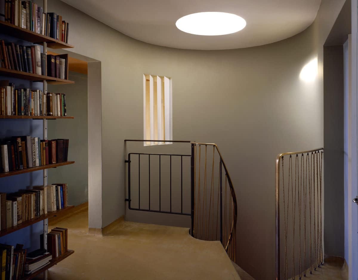 The staircase at 2 Willow Road serves as a central architectural element in the house, connecting the different levels while also contributing to the open-plan design.