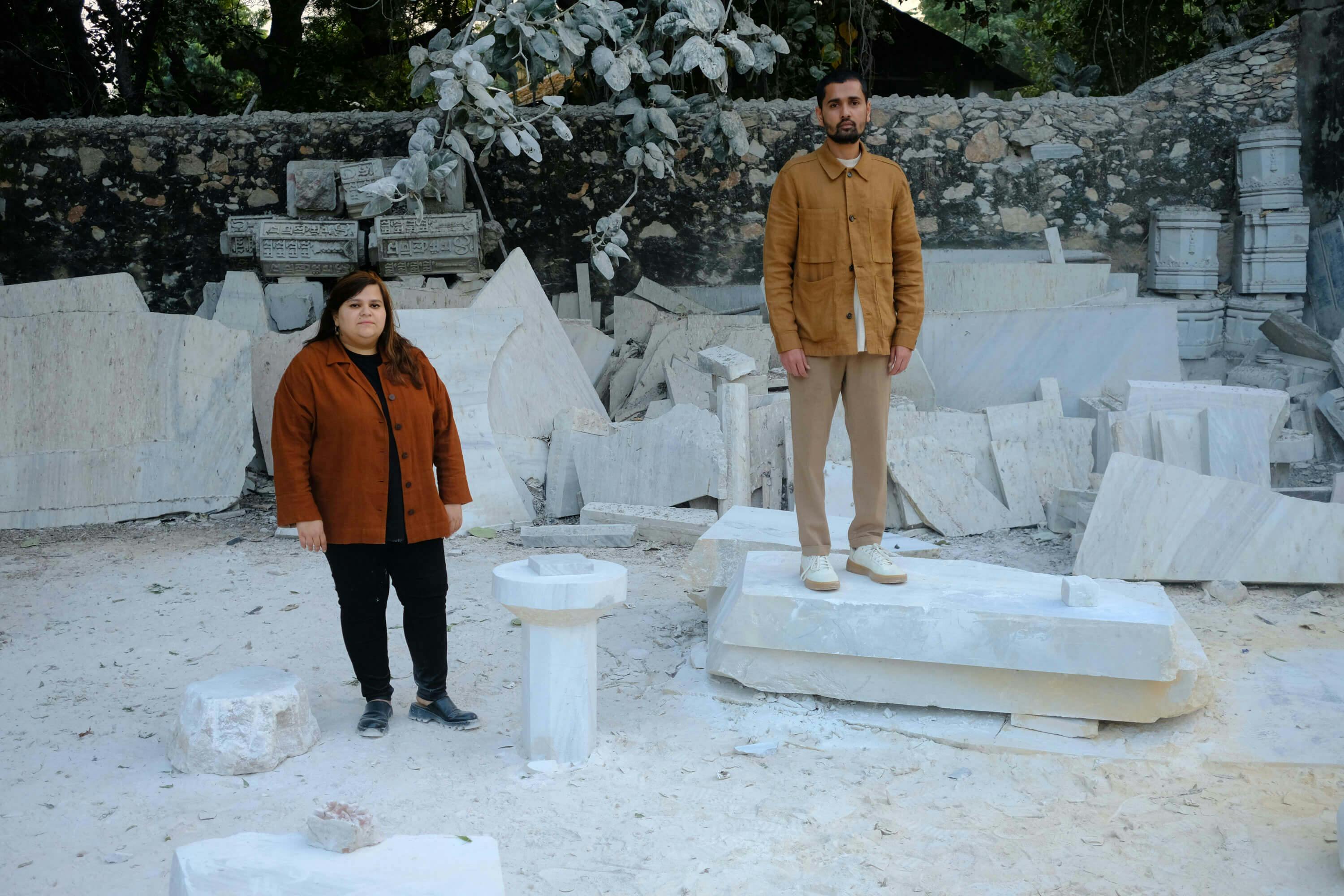 Priyanka Sharma and Dushyant Bashal of Studio Raw Material in a marble-dust covered garden outside of their Makrana workshop in Rajasthan, India