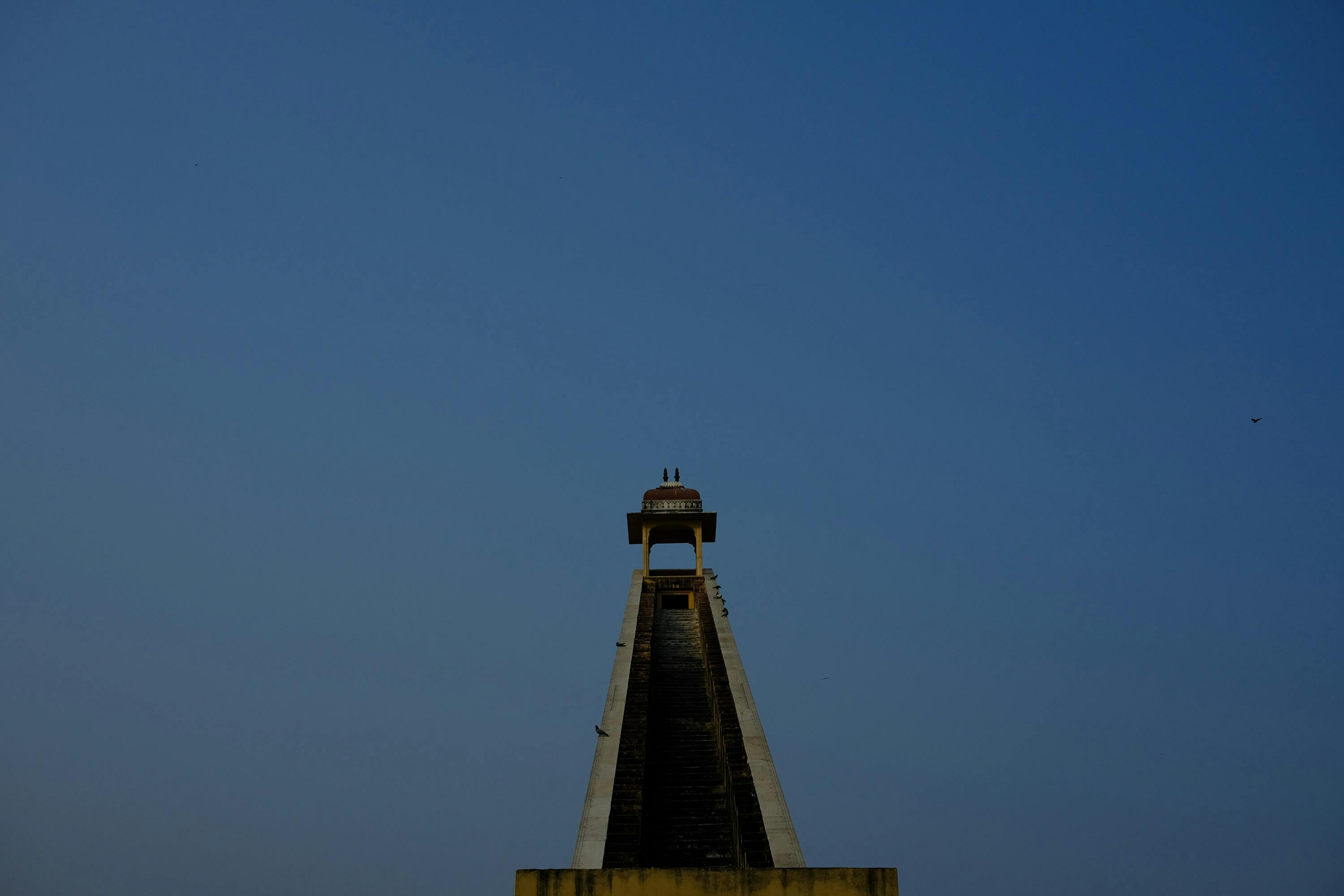 Jantar Mantar astronomical observatory in Jaipur, India, featuring historic stone instruments used for measuring time, tracking celestial bodies, and observing astronomical phenomena.