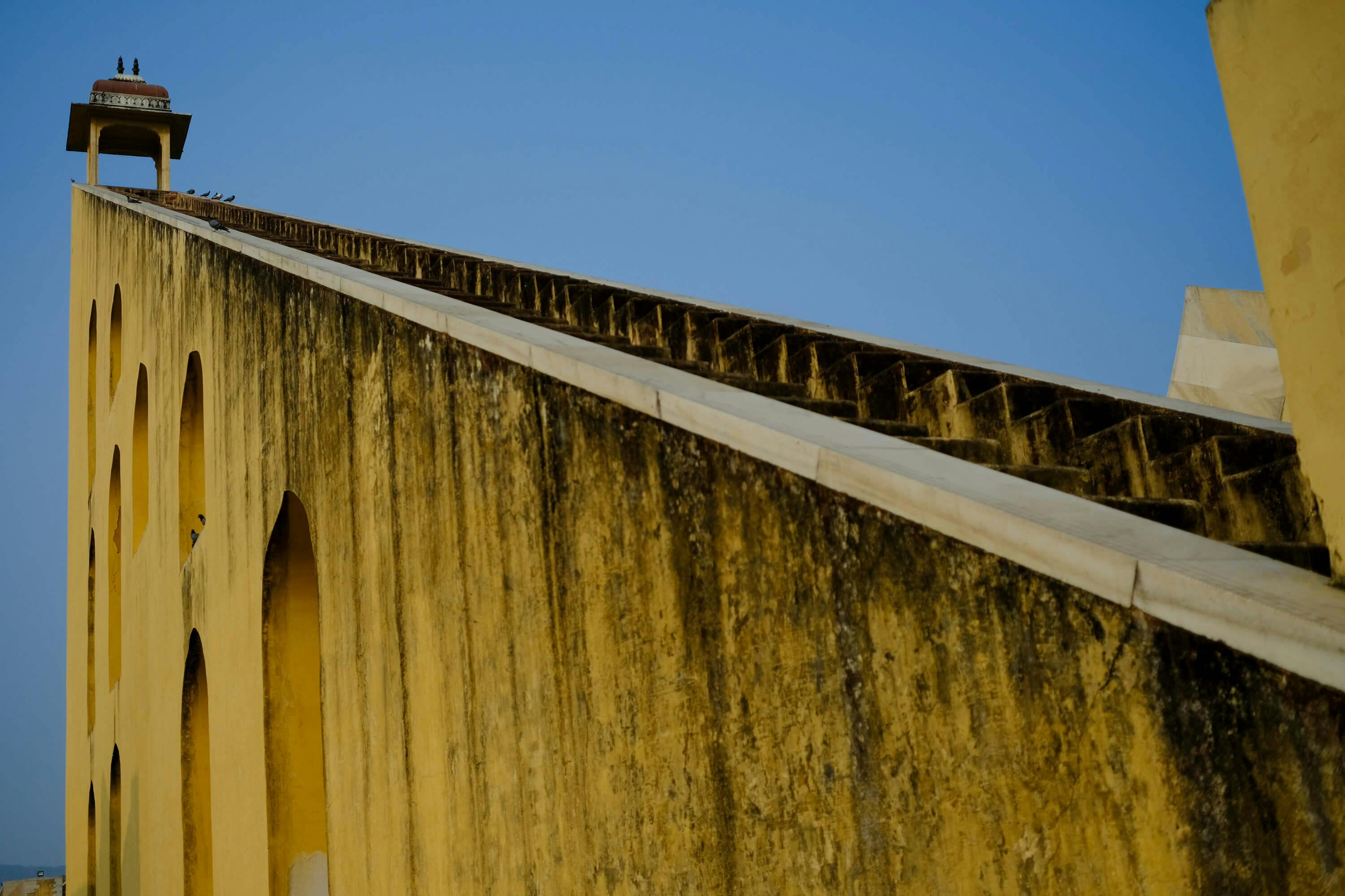 Jantar Mantar astronomical observatory in Jaipur, India, featuring historic stone instruments used for measuring time, tracking celestial bodies, and observing astronomical phenomena.