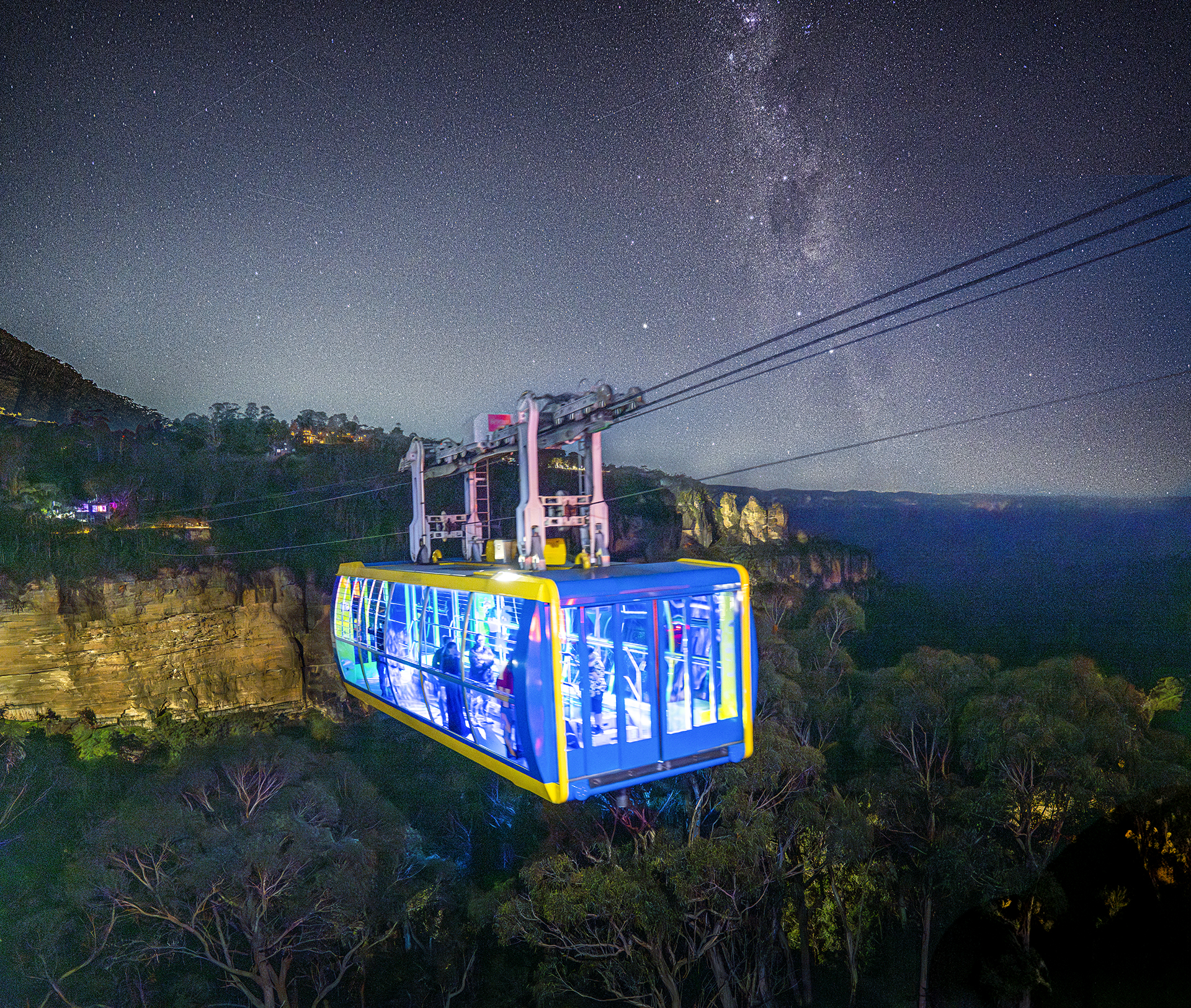 The Scenic Skyway next to the Three Sisters on a starry night