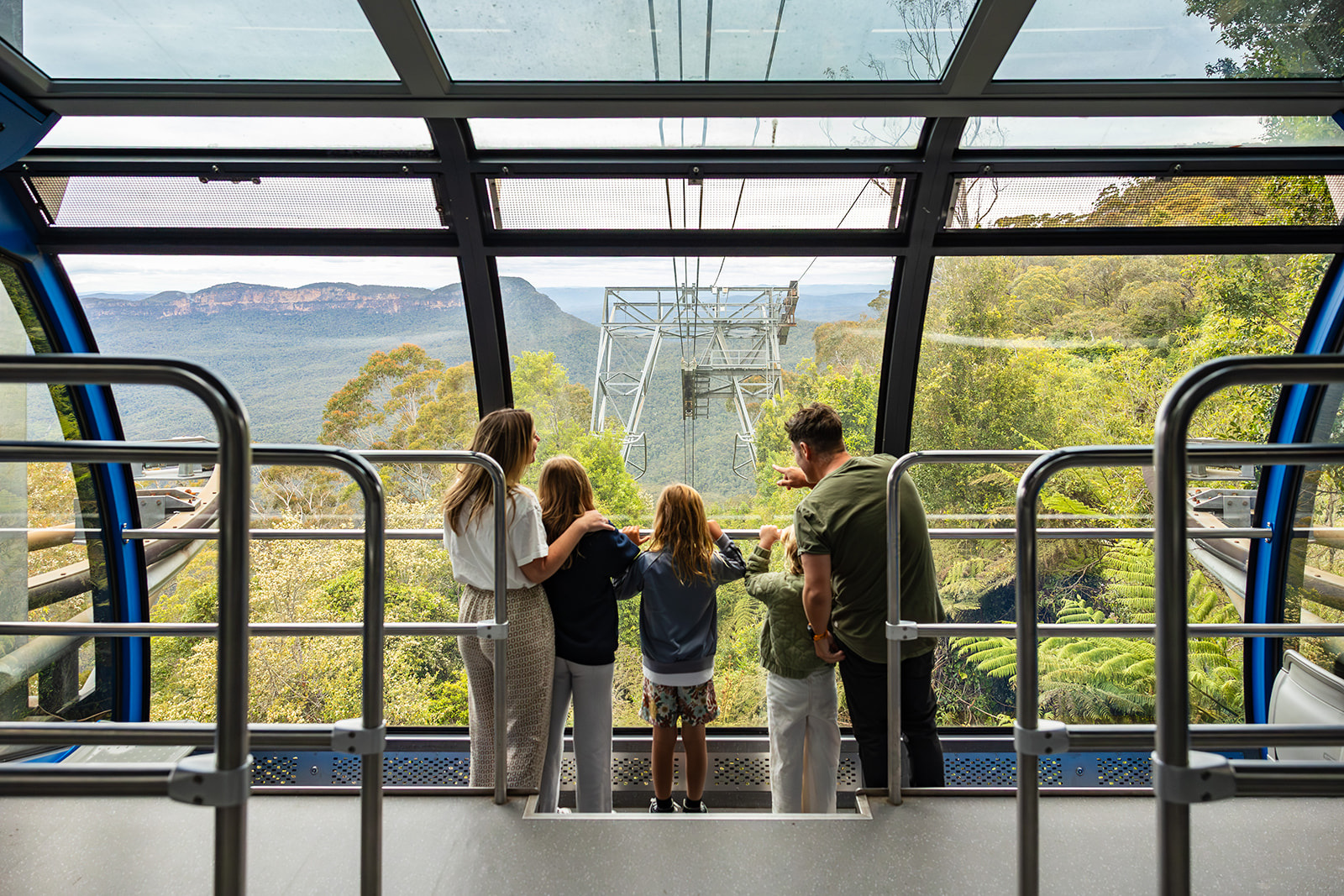 Family inside the Scenic Cableway