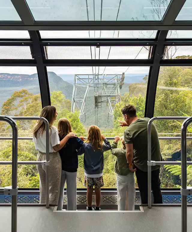 Family inside the Scenic Cableway