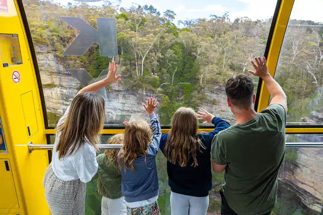 Family waving on the Scenic Skyway