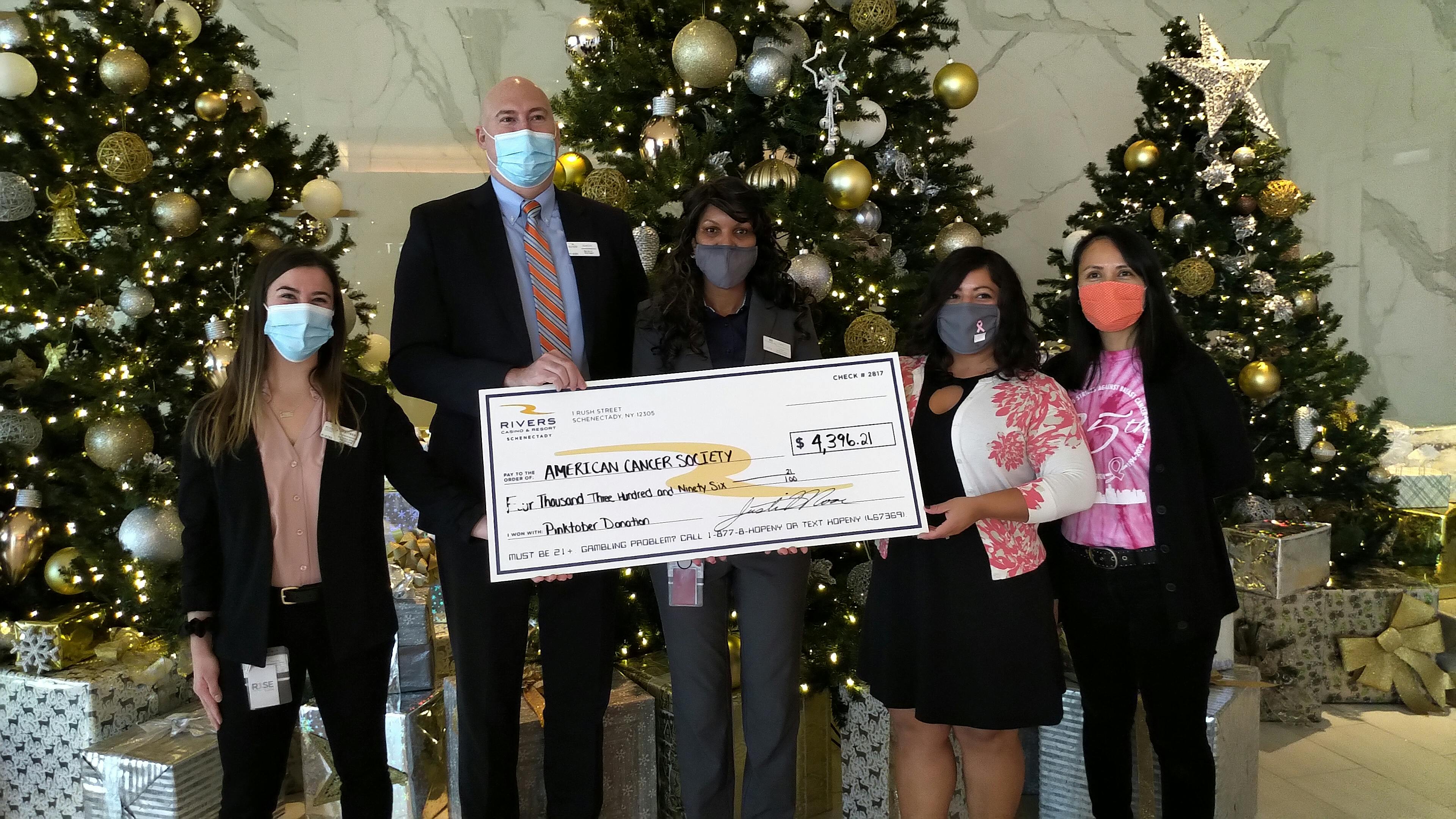 Rivers Casino Community Relations Manager, Marissa Riggi, Rivers Casino General Manager, Justin Moore, Landing Hotel Operations Manager and breast cancer survivor, Itzel Johnson Clark, ACS Senior Manager of Community Development, Annemarie Dillon, ACS Community Development Manager, Cynthia Somma.