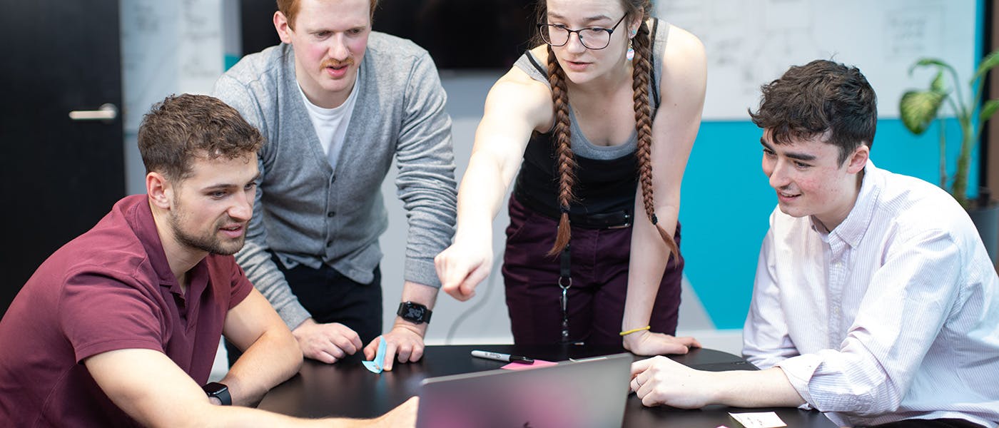 A group of graduates in a discussion