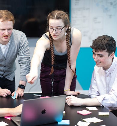 A group of graduates in a discussion