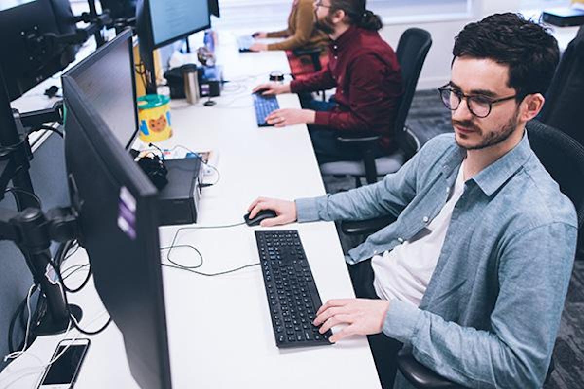 Man working at a computer in an office environment