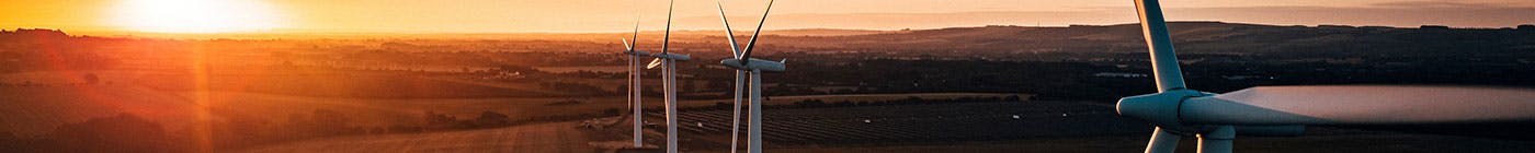 Wind turbines at sunset