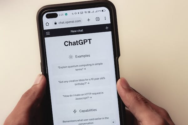Man uses ChatGPT on a phone.
