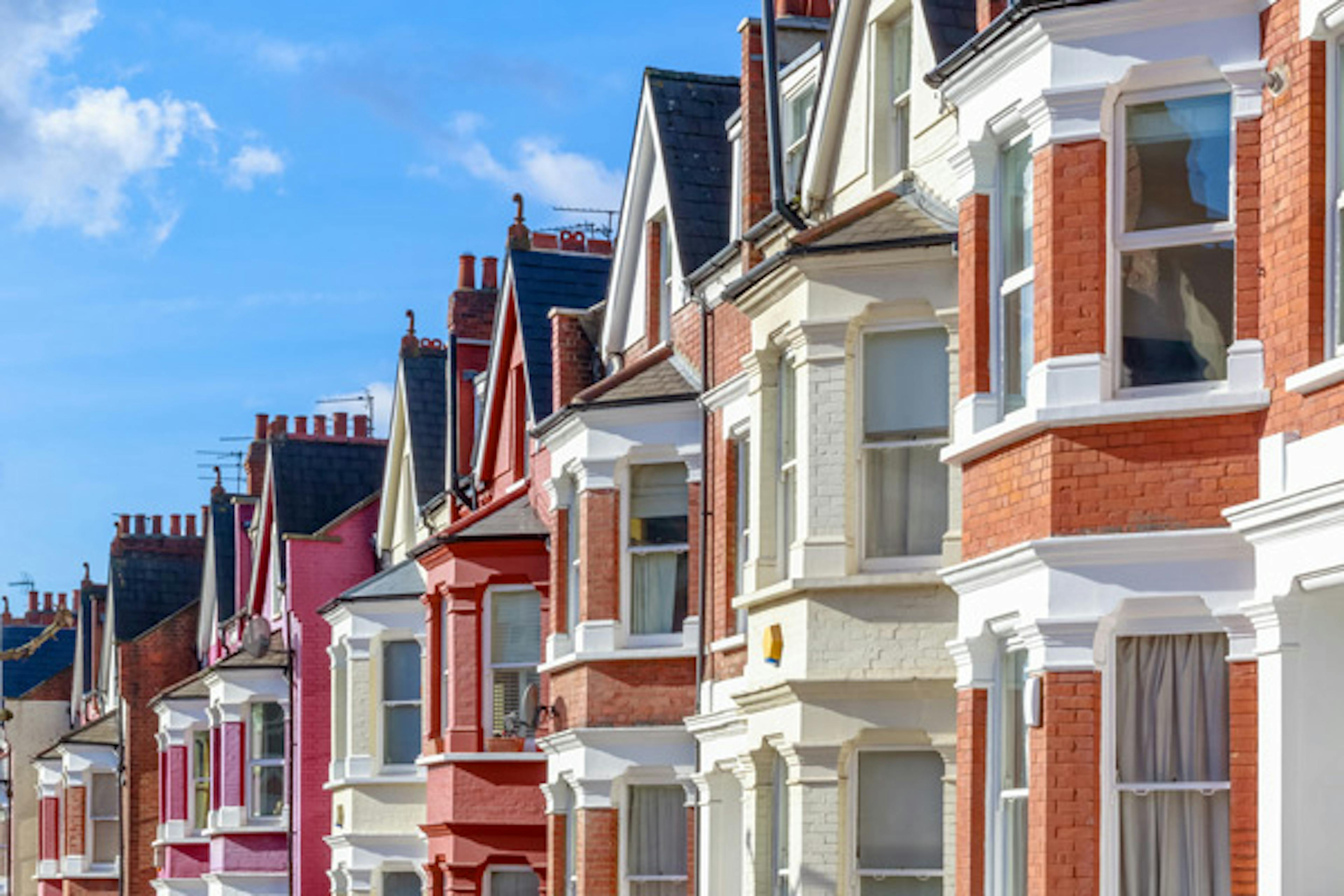 Row of colourful terraced houses on a sunny day