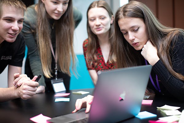 Consultants looking at a laptop screen