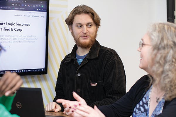 Two people in discussion during a meeting
