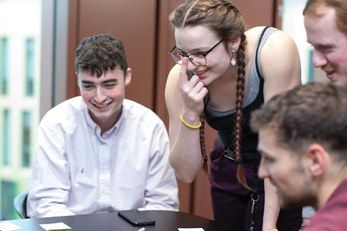 Group of employees around a desk