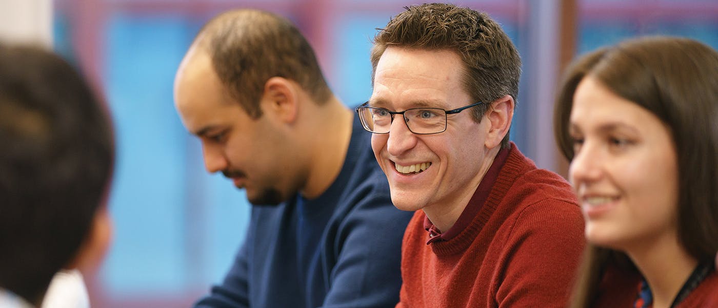 People in discussion and smiling