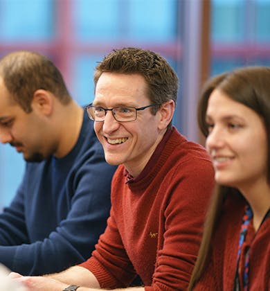 People in discussion and smiling