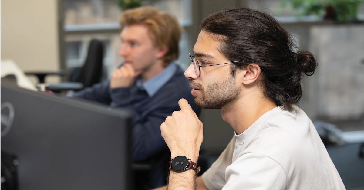 Workers sat at desk 