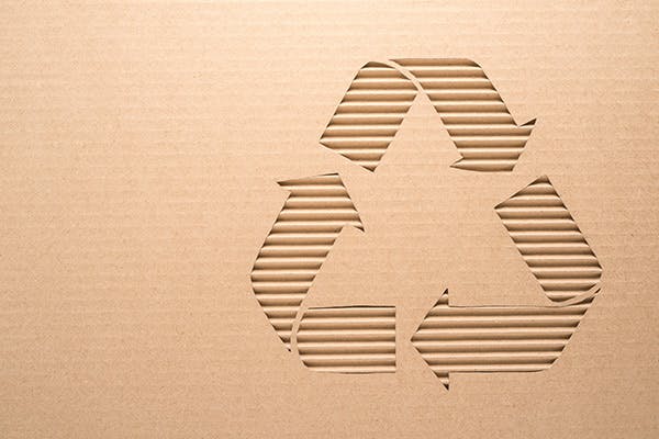 Cardboard with a recycling sign