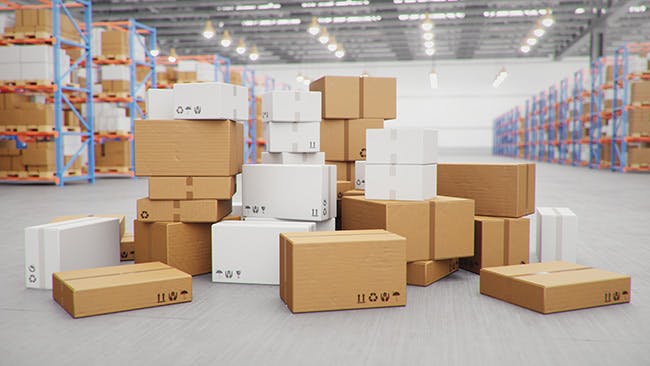 A pile of cardboard boxes in a warehouse