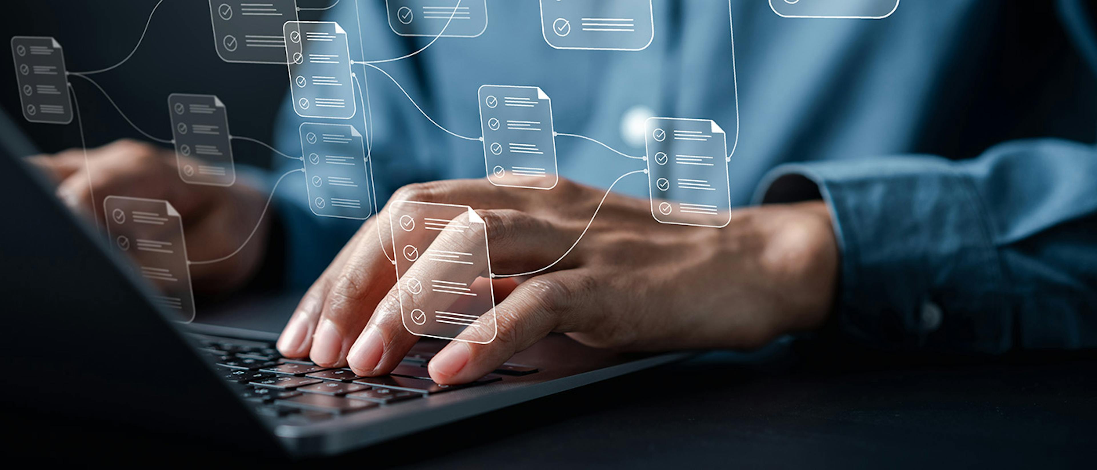 Person using a laptop keyboard with an overlay of interconnected documents