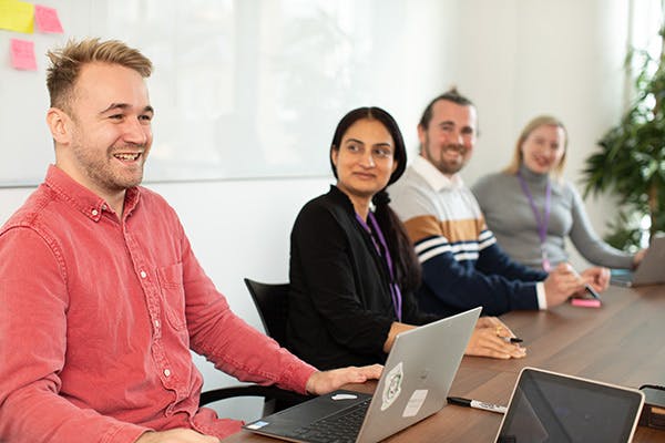 People in a meeting with laptops