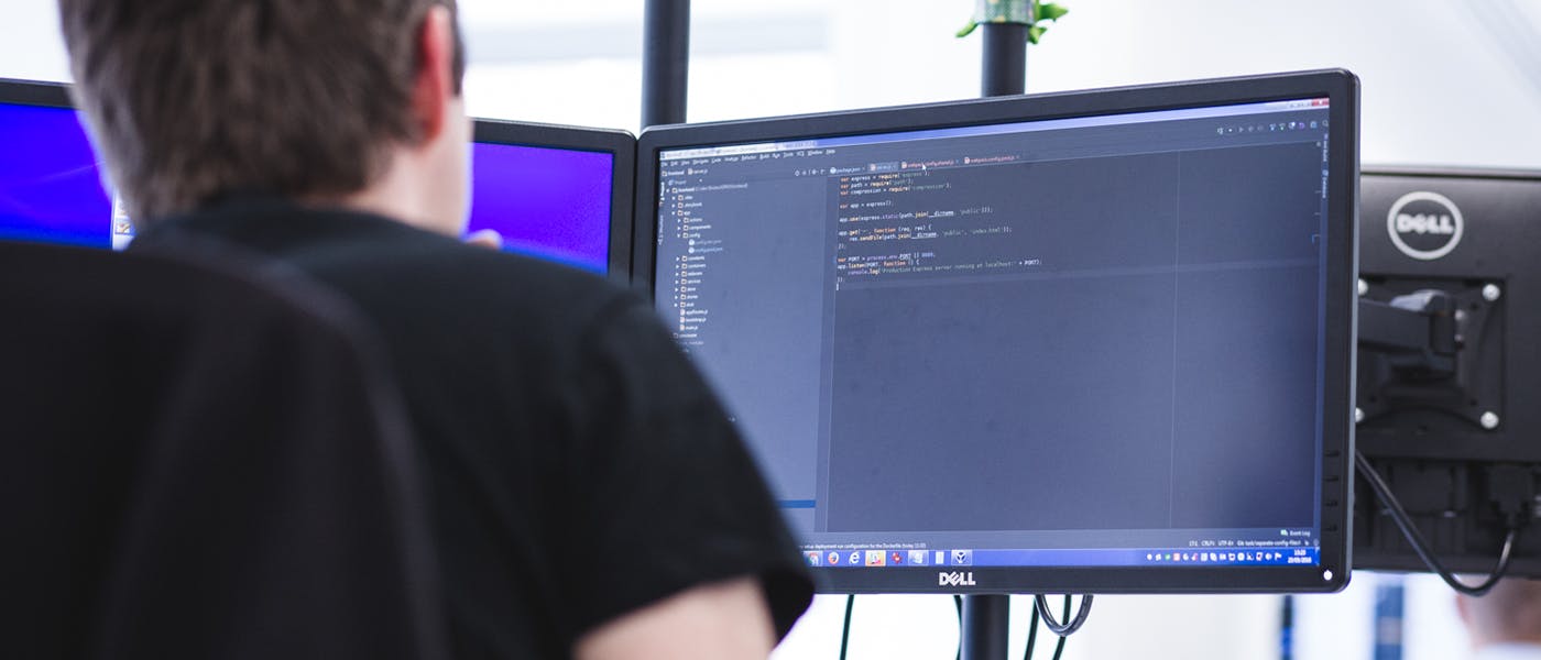 Man coding on a computer