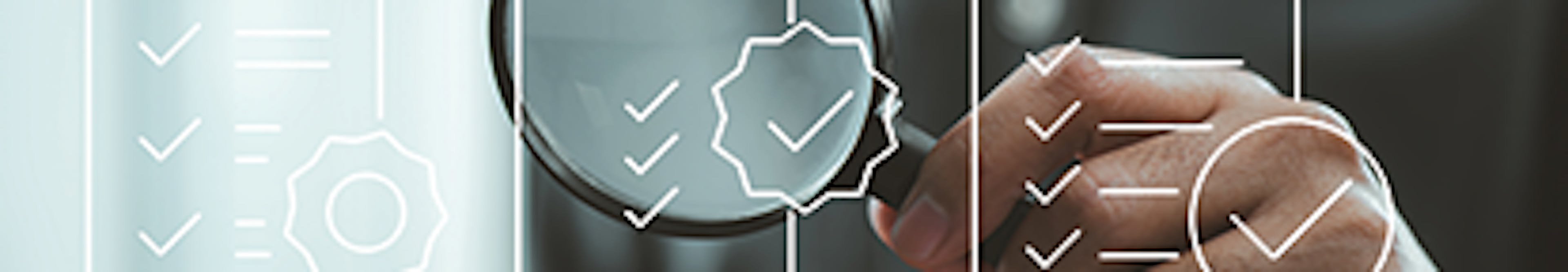 Person holds up magnifying glass to outlines of checklists